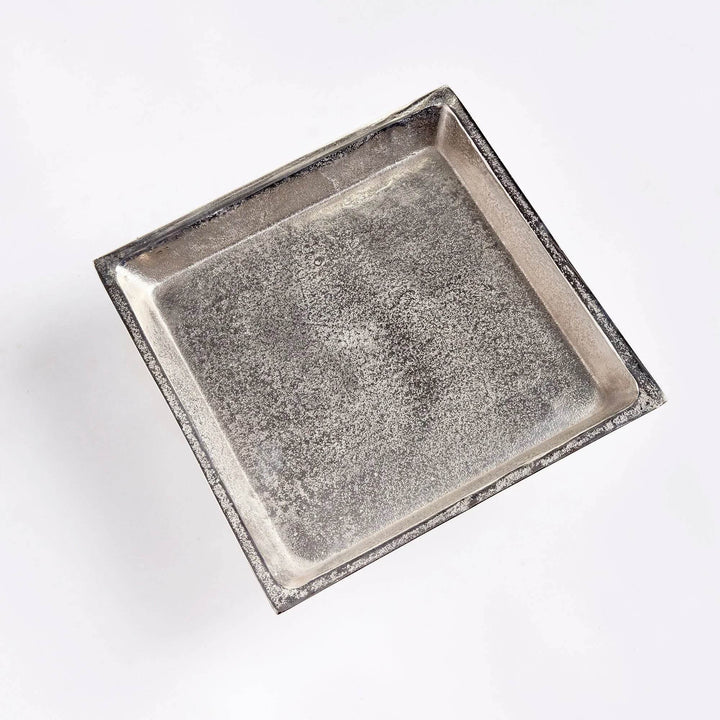 Top view of brushed nickel silver pedestal tray, cast aluminum construction for displaying candles, books, or decor.

