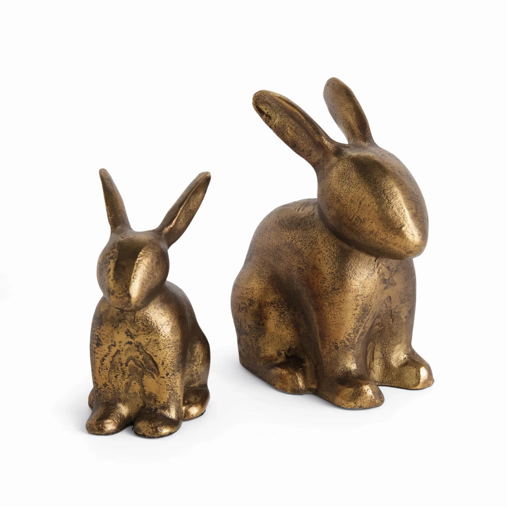 Pair of aluminum rabbit sculptures in antique brass finish with seated forms in two sizes for shelf or console decor Traditional Transitional style