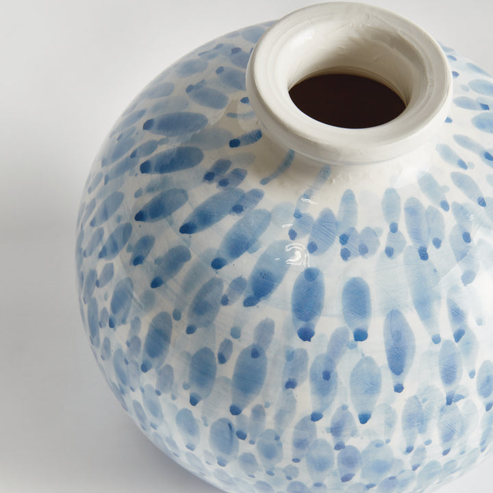 Close view of a small blue and white ceramic vase showing its narrow opening and painted droplet detail, Coastal Transitional