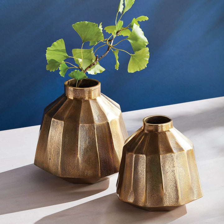 Small brass decorative vase paired with larger vase, styled on table with greenery, warm metallic accent for decor – Contemporary Classic.

