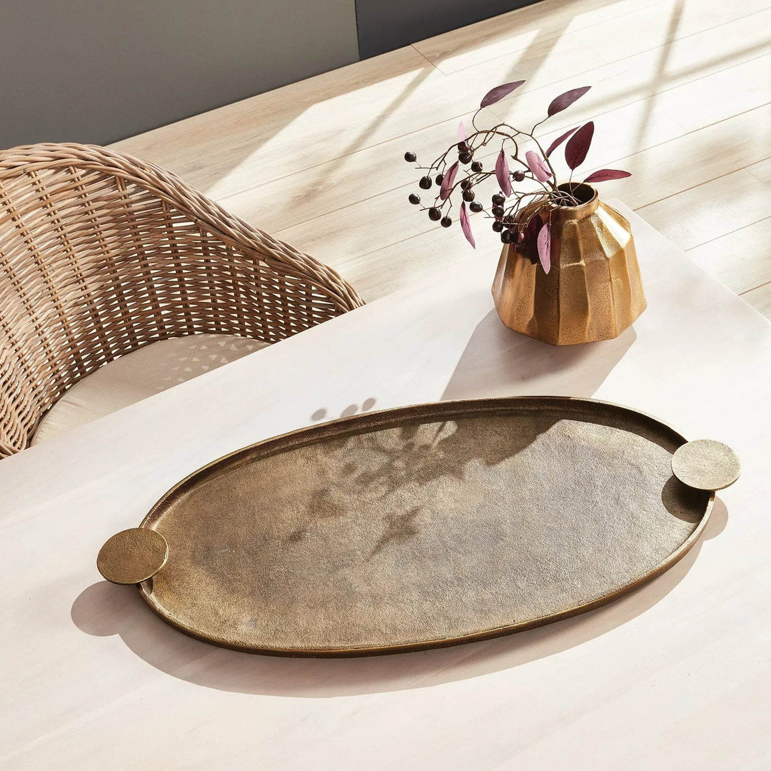 Small brass decorative vase with faceted design styled with tray on table, antique brass accent decor for home – Contemporary Classic.

