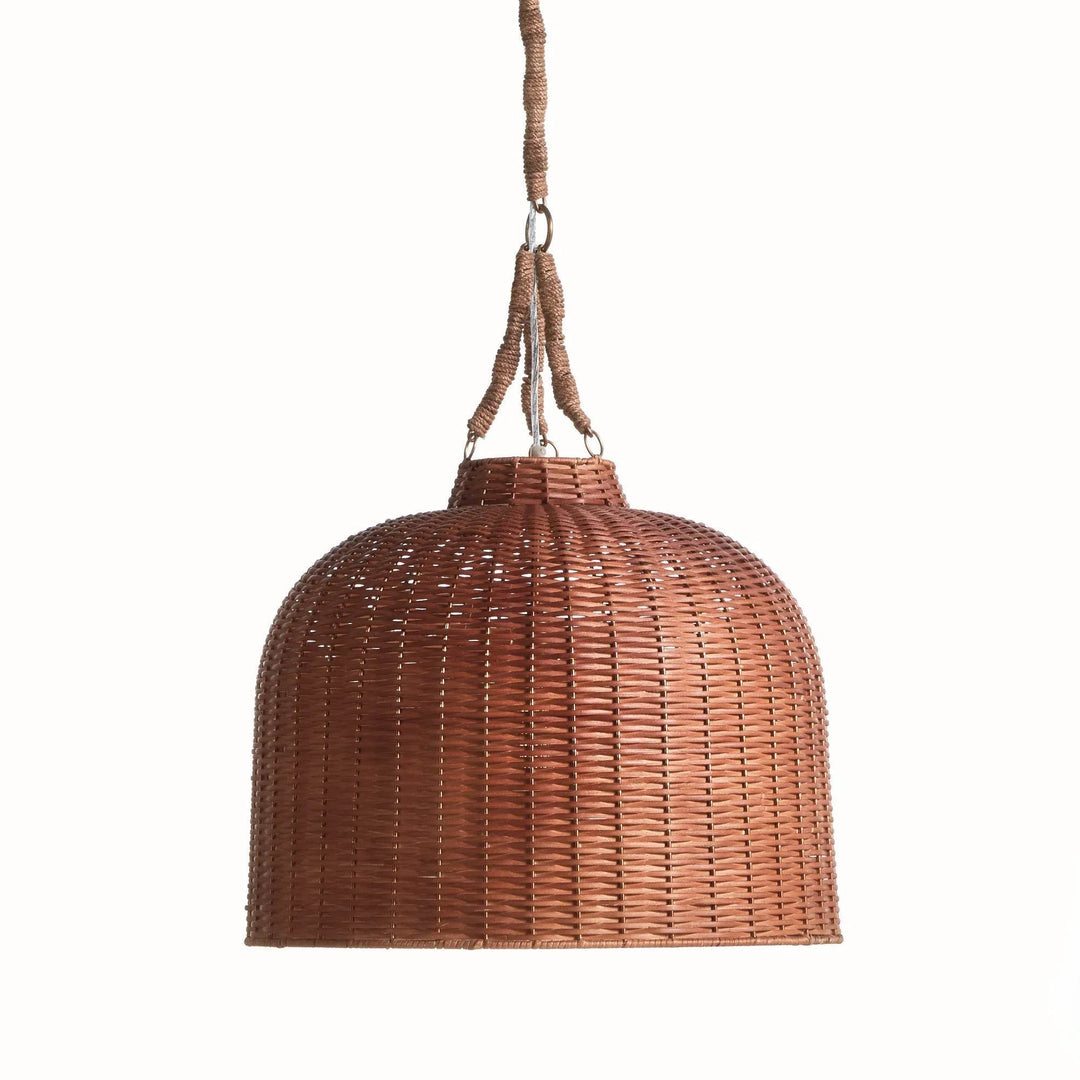 Small brown handwoven rattan bell pendant with a rounded shade and wrapped hanging supports against white, Coastal style