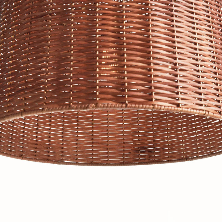 Small brown rattan bell pendant shade seen from below, showing the open rim and woven pattern inside the shade, Coastal style