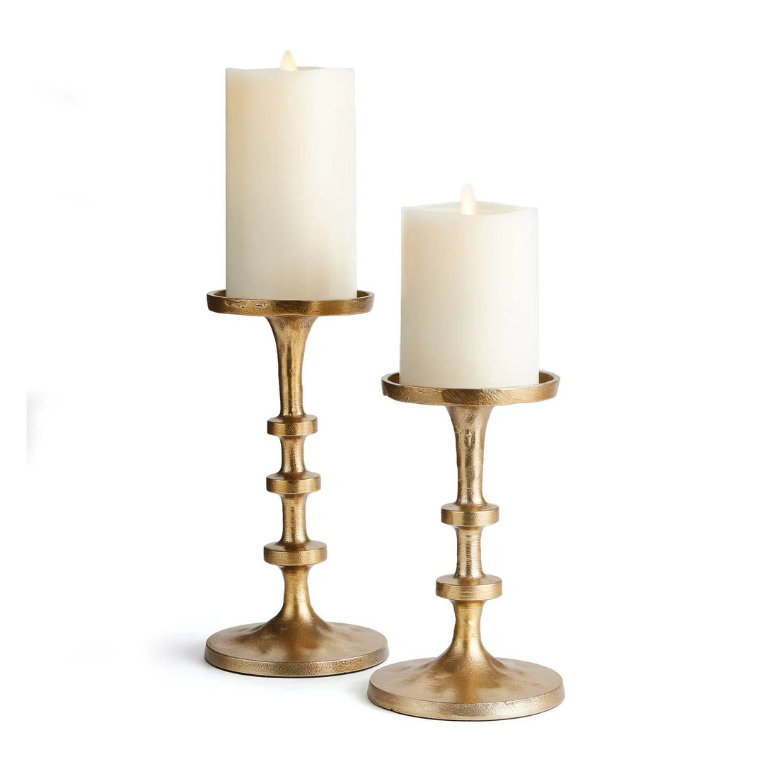 Set of 2 small gold pillar candle holders with white pillar candles, modern design with round bases and stepped columns