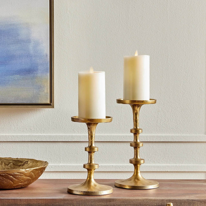 Gold pillar candle holders set of 2 styled on wooden tabletop, modern small-scale accent holders for home décor