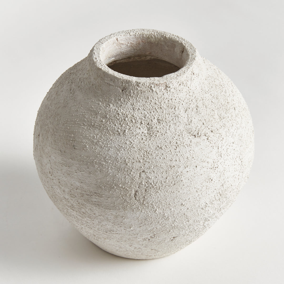 Close-up view of small gray terracotta vase with textured handcrafted surface and rounded form, artisan transitional accent – Transitional