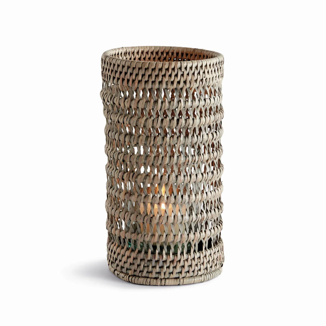 Small graywash handwoven rattan hurricane candleholder with an open cylindrical body and glass insert, on white, Transitional