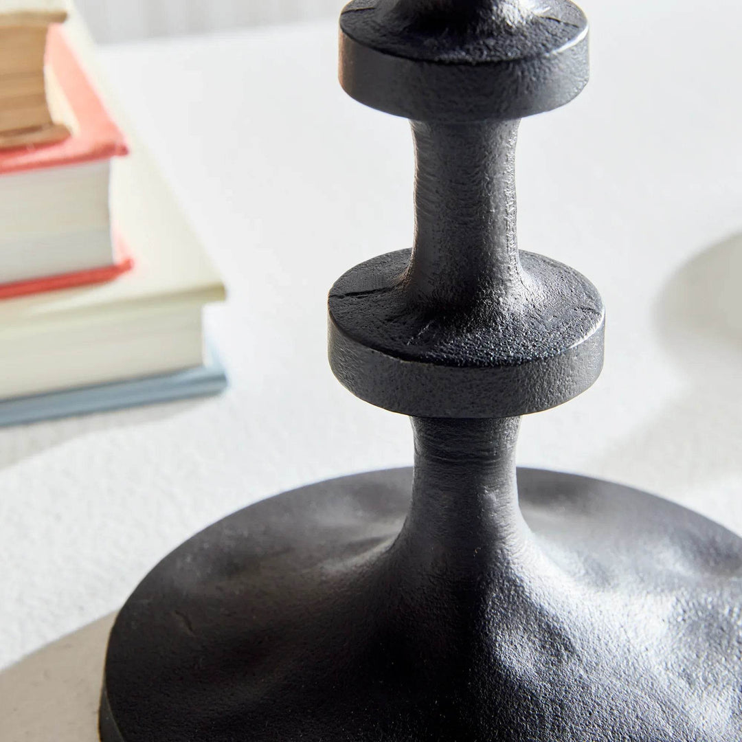Pair of small industrial candle holders in black bronze finish photographed from angled view on tabletop – Modern Industrial