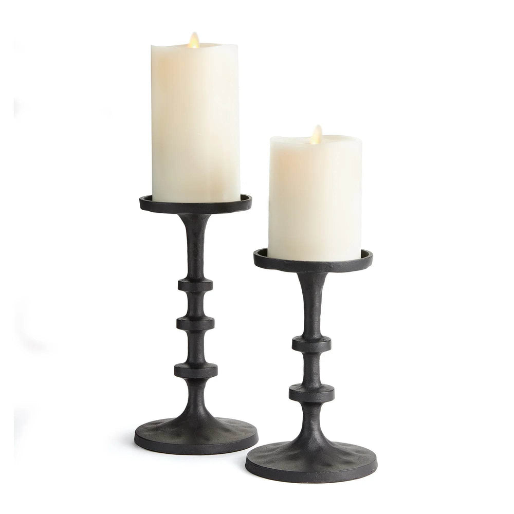 Set of 2 small industrial black bronze candle stands displayed on white background with LED pillar candles – Contemporary