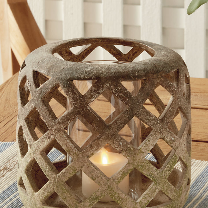 Close-up of small moss terracotta hurricane candle holder with textured lattice detailing – Rustic Transitional style.