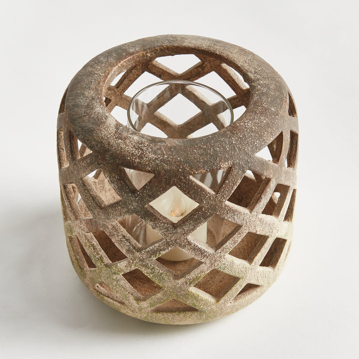 Top angled view of small moss terracotta hurricane candle holder with lattice cutouts – Organic Transitional style.