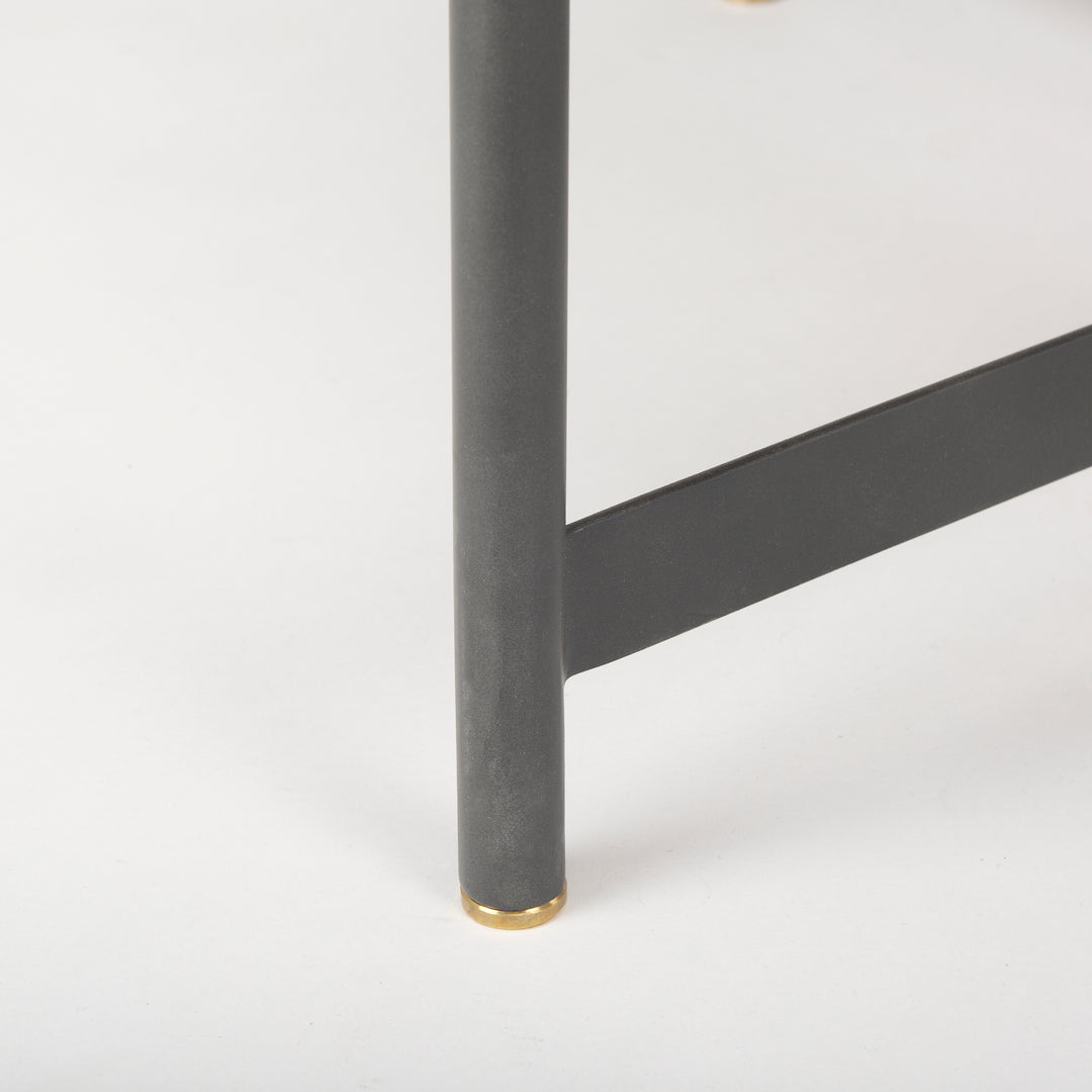 Close-up of the black iron table leg with gold metal cap supporting the solid mango wood top, Modern Organic coffee table