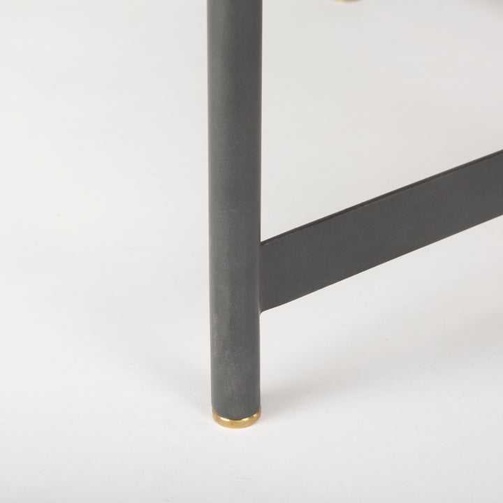 Close-up of the black iron table leg with gold metal cap supporting the solid mango wood top, Modern Organic coffee table