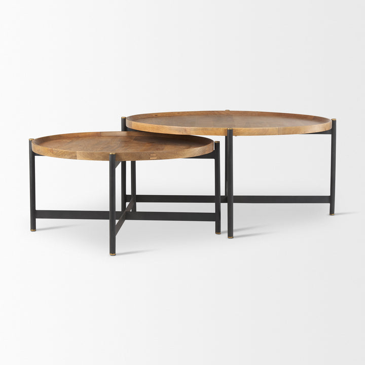 Small round mango wood coffee table shown beside coordinating larger coffee table from the collection, Modern Organic coffee tables