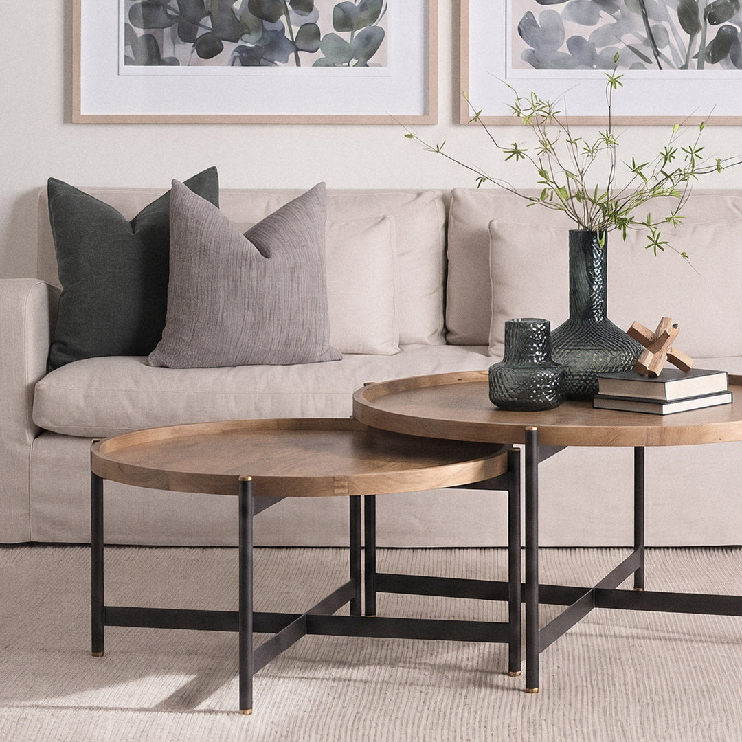 Small round mango wood coffee table styled in a contemporary living room with neutral furnishings, Modern Organic coffee table