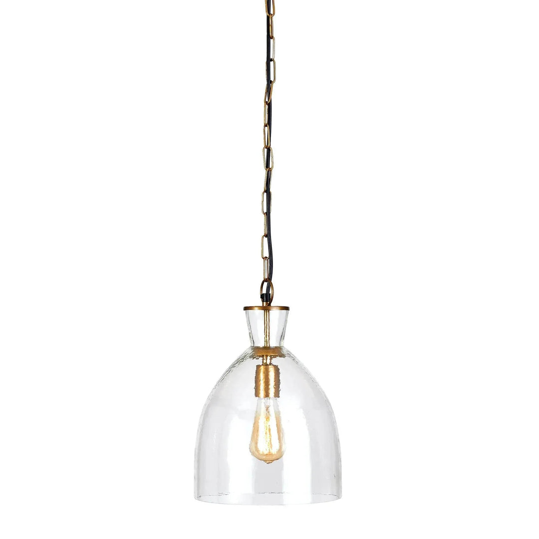 Small clear seeded glass bell pendant with brass-finished fittings and a hanging chain against white, Transitional style