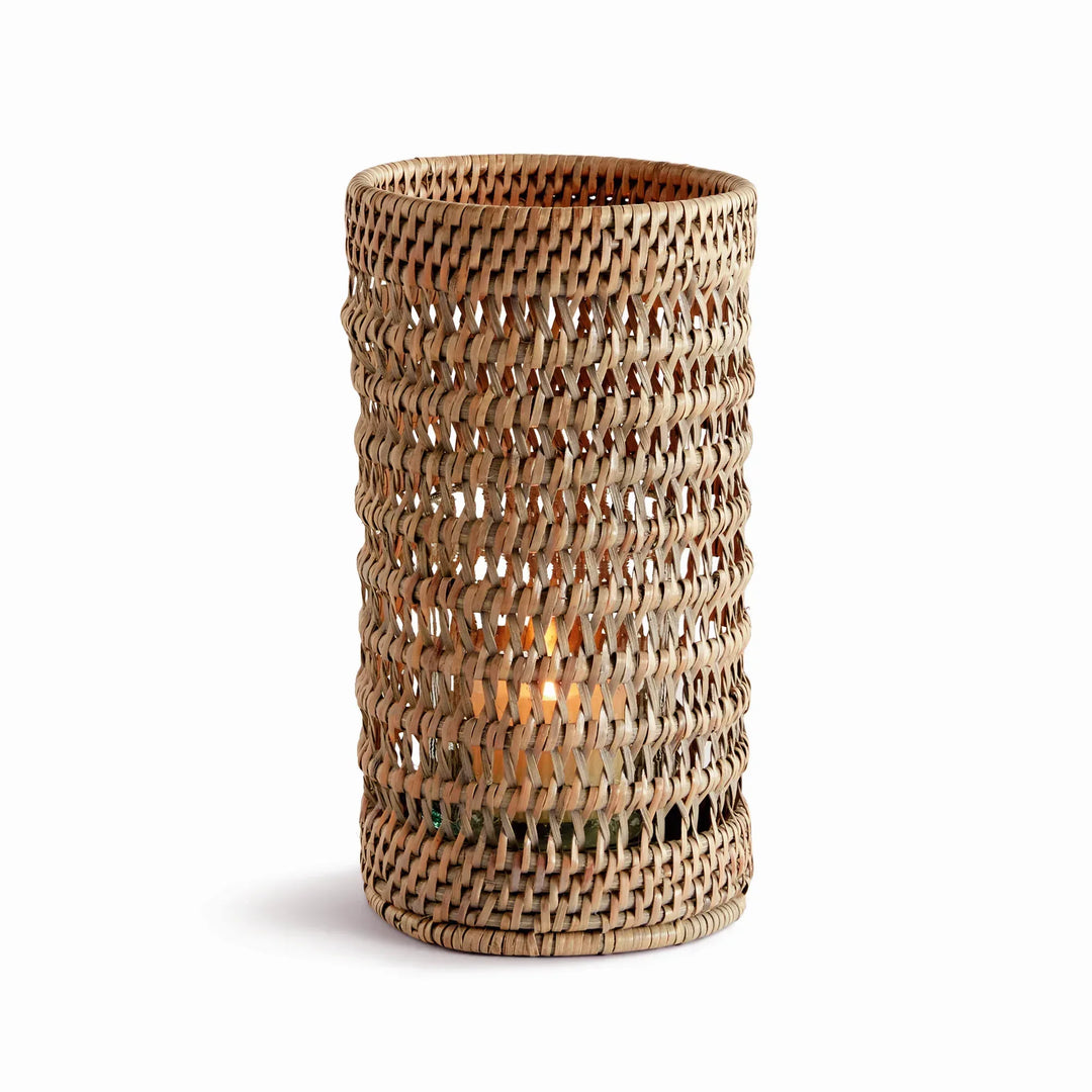 Small warm brown handwoven rattan hurricane candleholder with open cylindrical body and glass insert, on white, Transitional