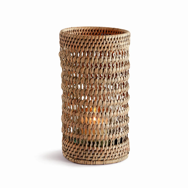 Small warm brown handwoven rattan hurricane candleholder with open cylindrical body and glass insert, on white, Transitional