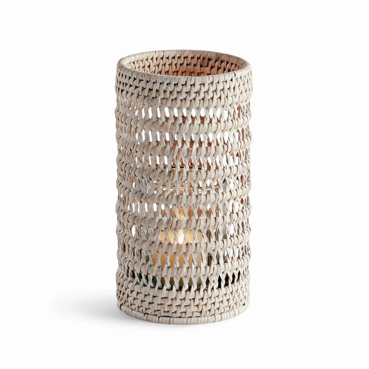Small whitewash handwoven rattan hurricane candleholder with open cylindrical body and glass insert, on white, Transitional
