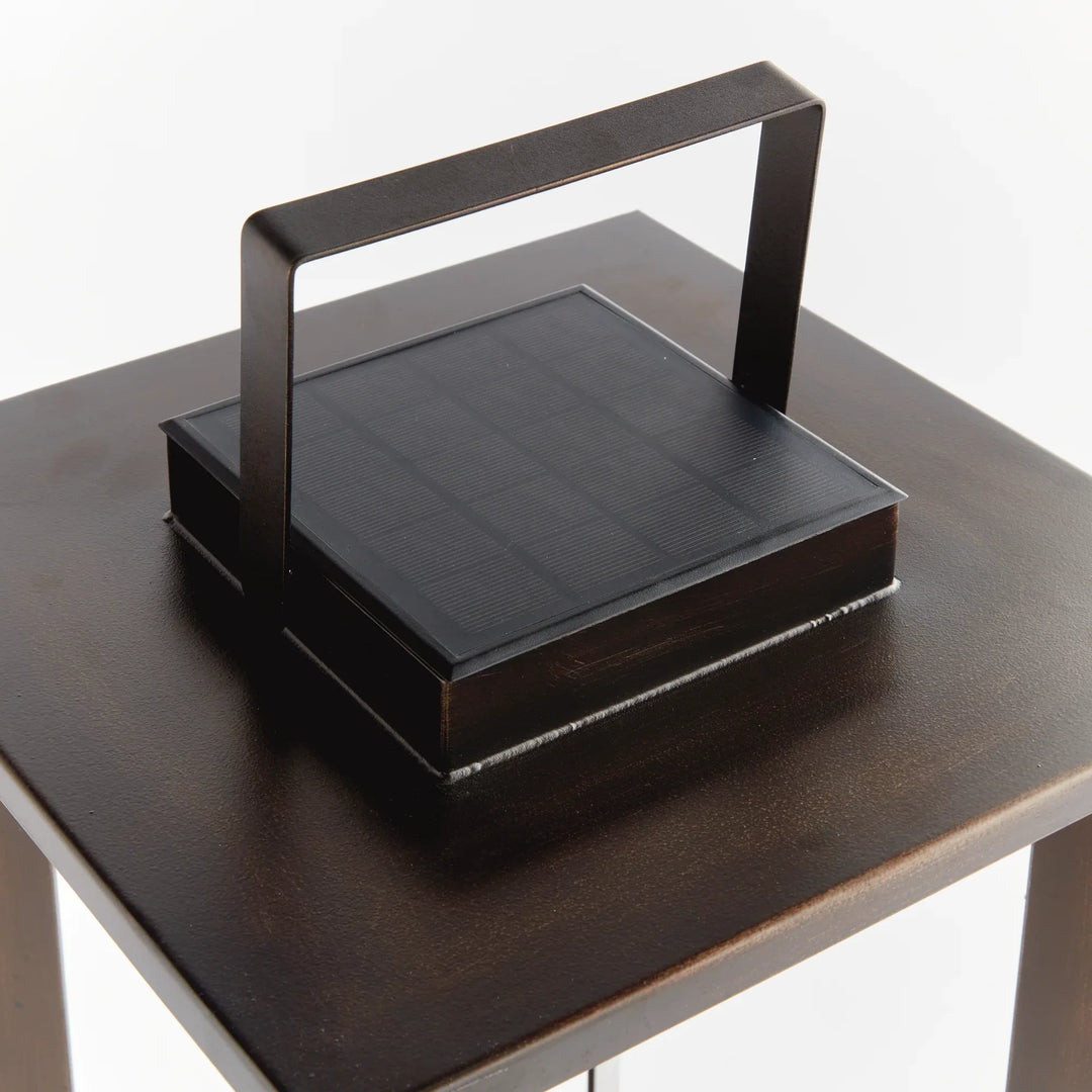 Top view of integrated solar panel on outdoor lantern, clean modern design with built-in charging surface for efficient sunlight use