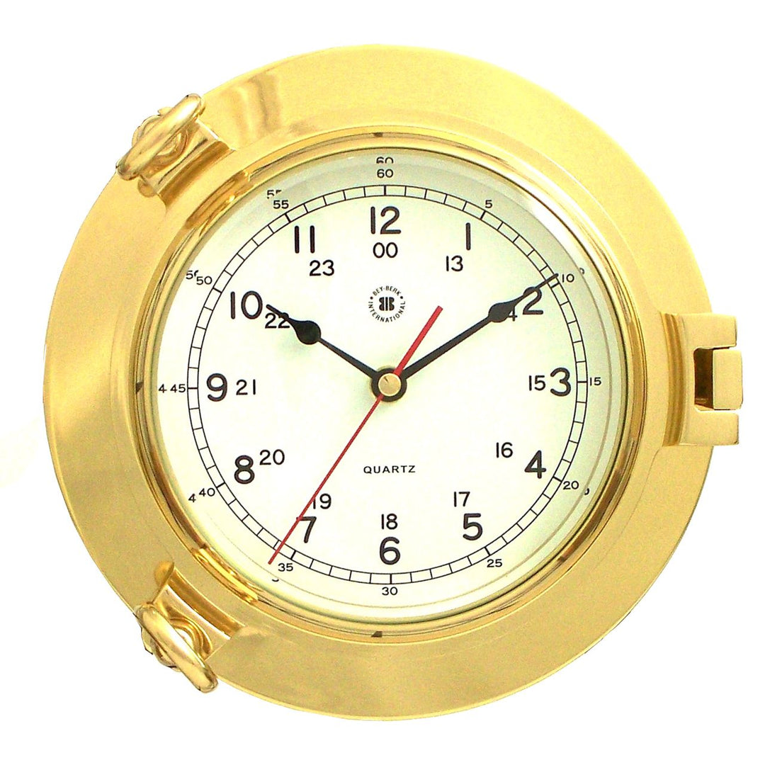 Solid brass porthole wall clock with beveled glass and round quartz dial shown front view for coastal home decor style