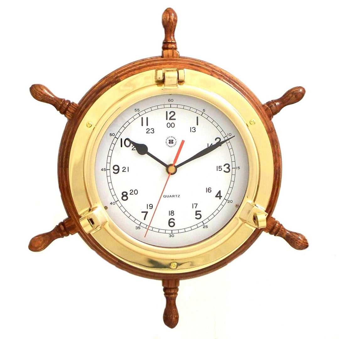 Solid brass ship wheel wall clock with oak wood frame and round quartz dial shown front view for nautical decor style