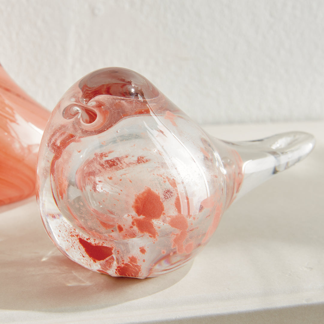 Single speckled melon glass finch sculpture with rounded form and glossy finish, decorative bird for tabletop display.