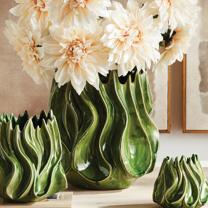 Sylva large green vase with pale flowers beside the medium and small matching vases against framed artwork. Modern Organic