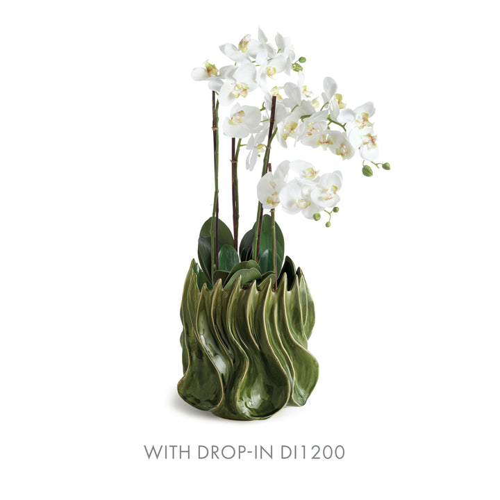 Sylva large green vase with a tall white orchid drop-in and green leaves against a plain white background. Modern Organic