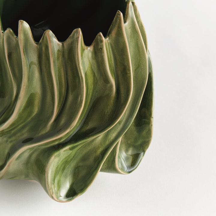 Detail of Sylva medium vase showing the glossy green glaze and raised flowing curves near the pointed rim. Modern Organic