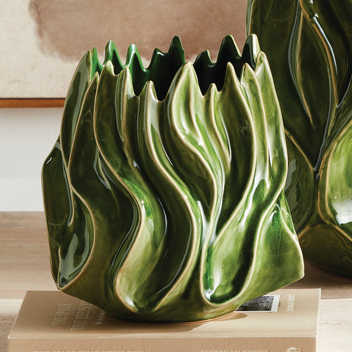 Sylva medium green sculptural vase on stacked books beside a larger coordinating vase in a pale interior. Modern Organic