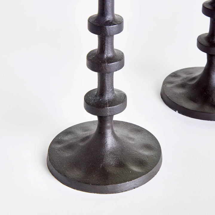 Detail view of industrial bronze taper holder stem and round base
