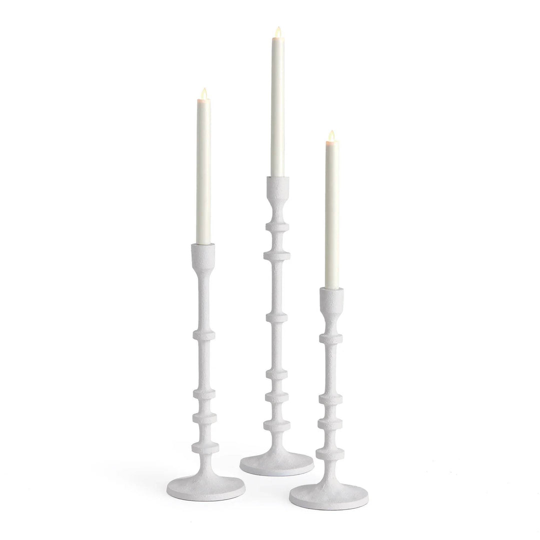 Tall white taper candle holders in a set of three with slim stacked stems and graduated heights, styled with LED candles – Modern Farmhouse.