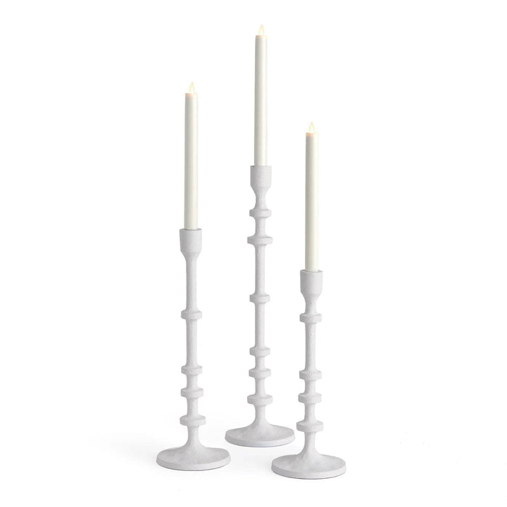 Tall white taper candle holders in a set of three with slim stacked stems and graduated heights, styled with LED candles – Modern Farmhouse.