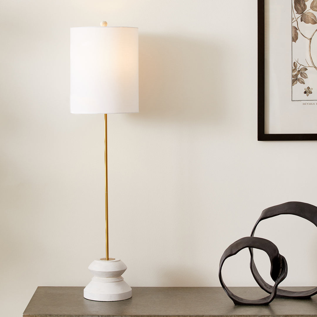 Tall whitewashed table lamp on console with sculptural decor, modern rustic entryway styling
