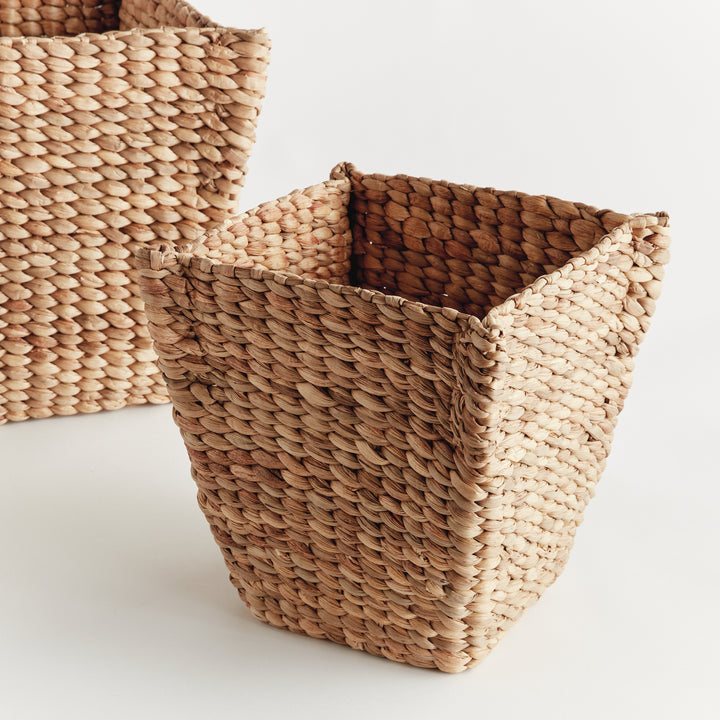 Close view of Tamsin small tapered basket with open square top and natural weave beside the larger matching basket. Coastal
