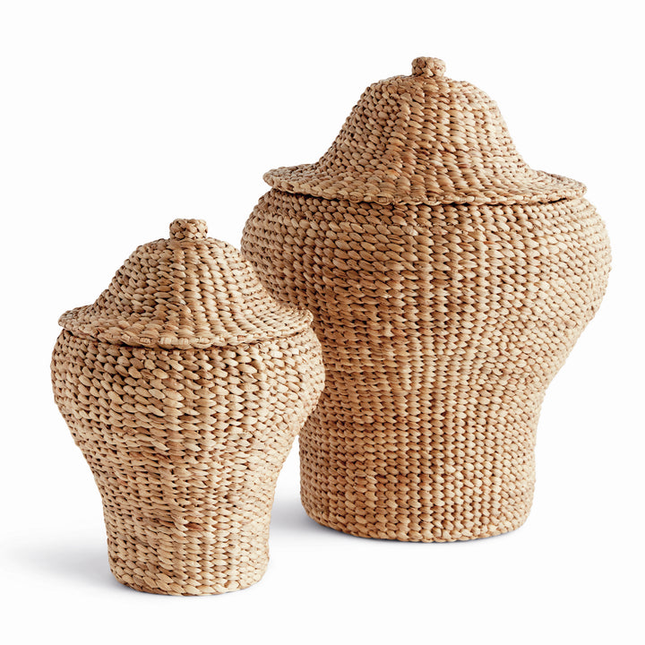 Tamsin natural water hyacinth ginger jars in two graduated sizes with shaped woven lids against a pale background. Coastal