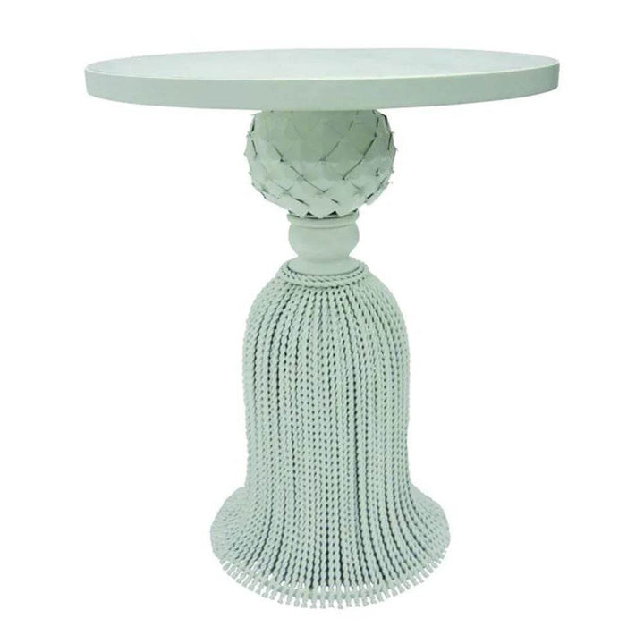 White tassel side table with pineapple accent and skirted base

