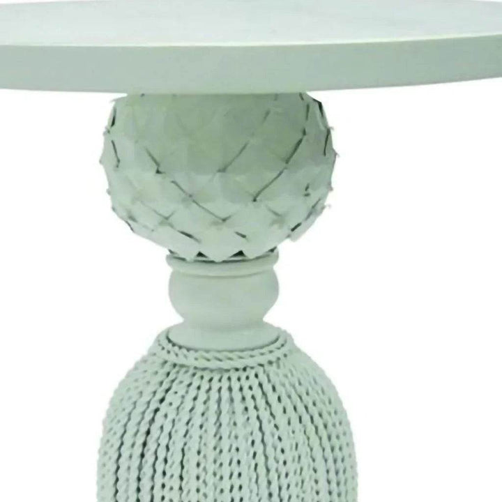Pineapple accent detail on white tassel side table

