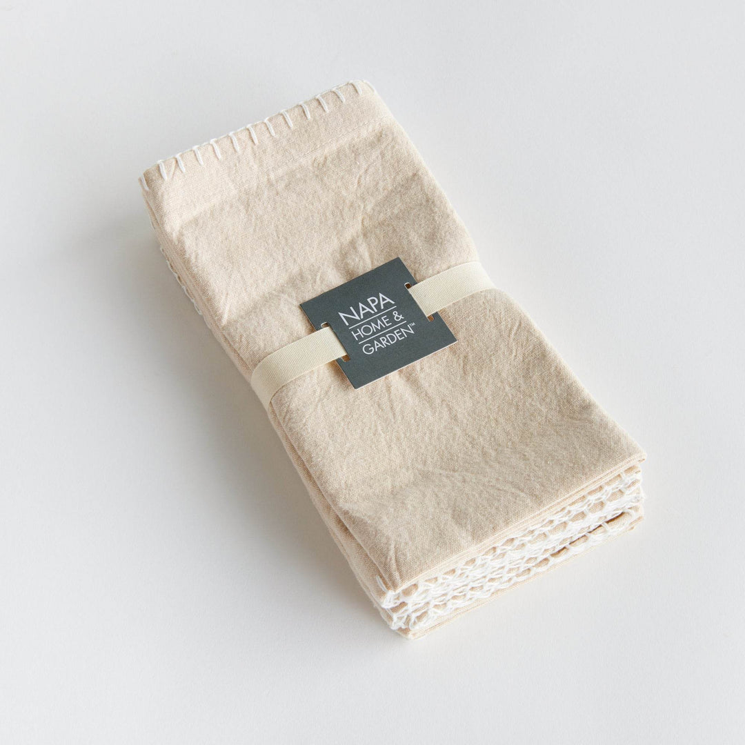 Set of four taupe cotton napkins tied with grosgrain ribbon and branded band, gift-ready presentation – Modern Farmhouse.