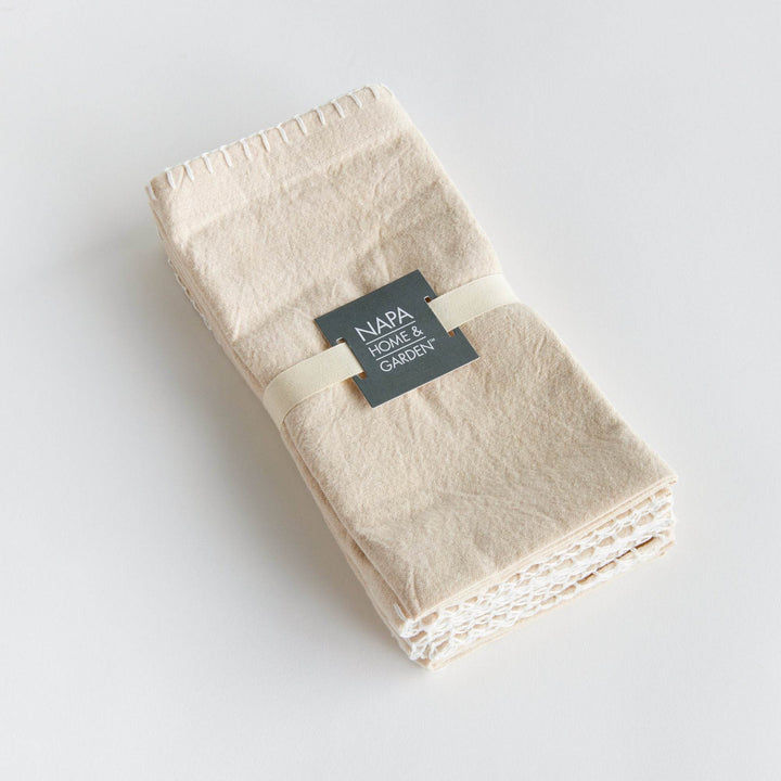 Set of four taupe cotton napkins tied with grosgrain ribbon and branded band, gift-ready presentation – Modern Farmhouse.