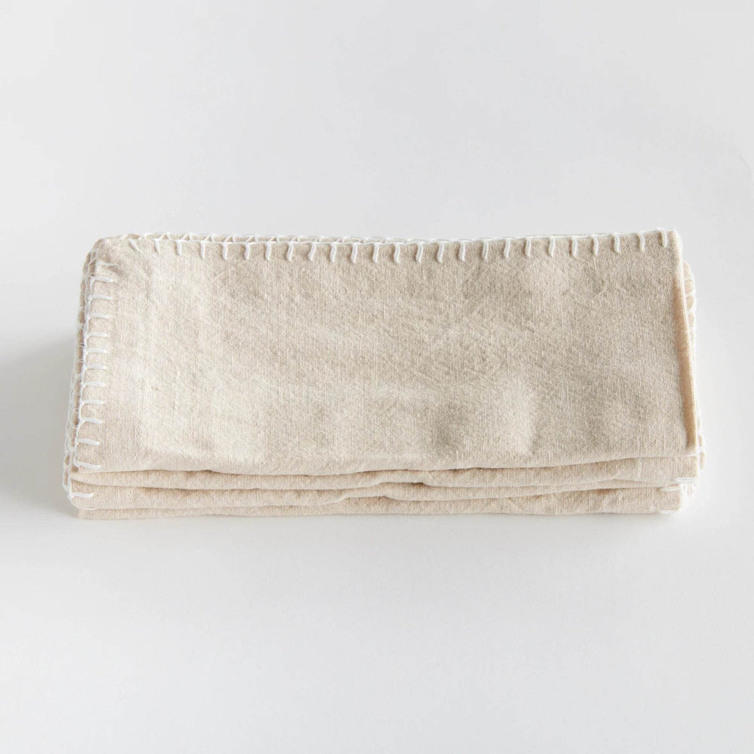 Single taupe cotton napkin laid flat with stitched edge detail visible, simple neutral design for everyday dining – Modern Farmhouse.