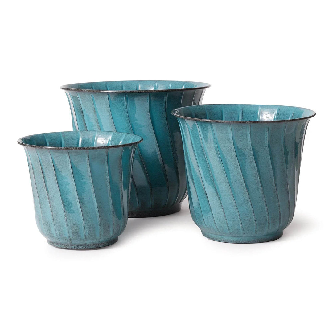 Set of three teal enamel metal planters with curved fluted sides in varying sizes, shown in a studio-style product image.