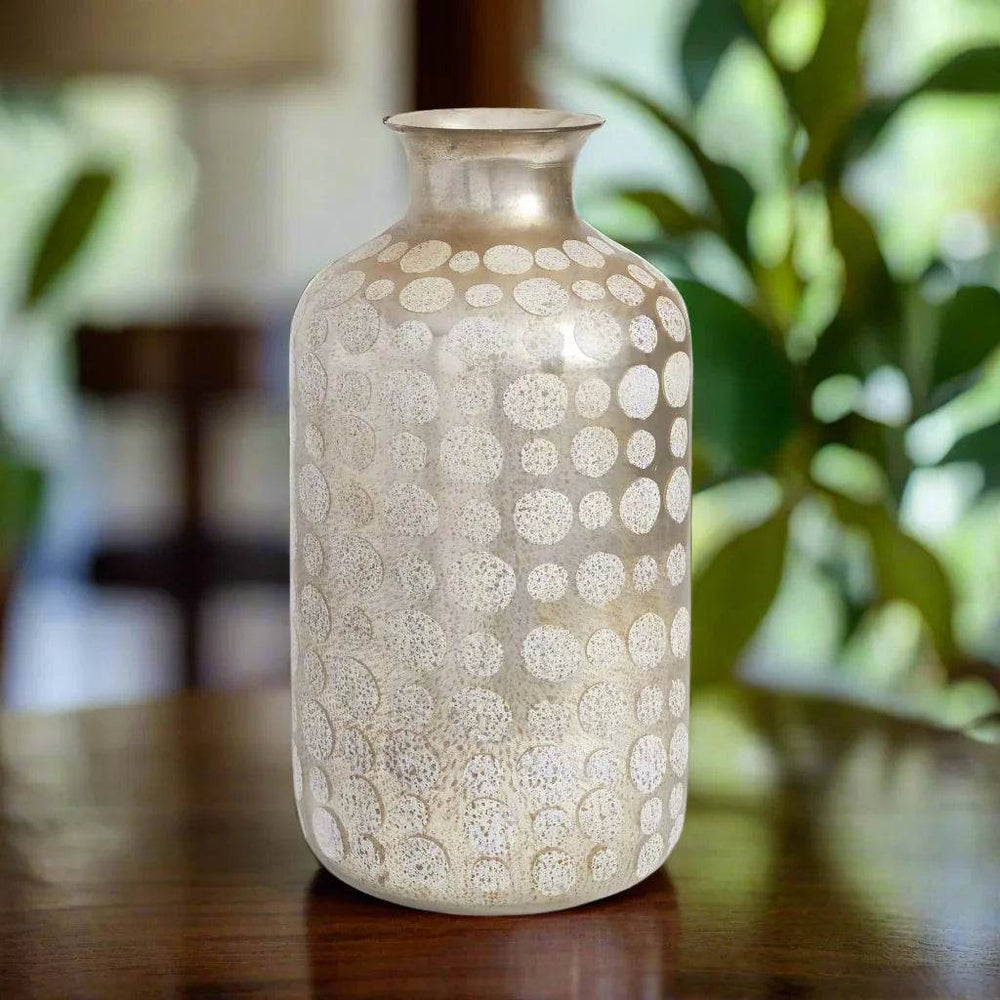 Textured gold mercury glass vase on wood table with soft daylight and natural decor