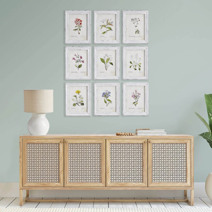 Vintage botanical wall art set of 9 with distressed white frames styled above console table