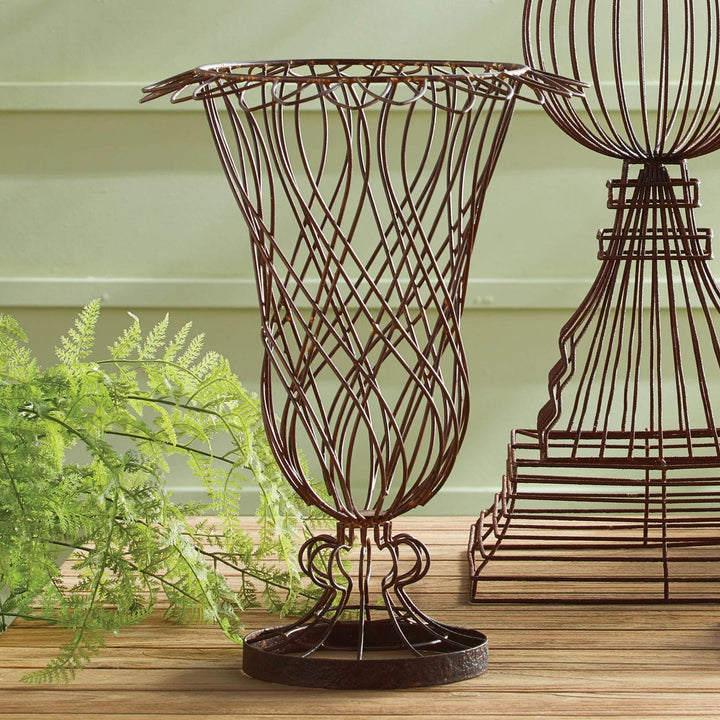 Rustic metal wire vase displayed with faux greenery, styled on a wooden tabletop – Vintage Farmhouse style