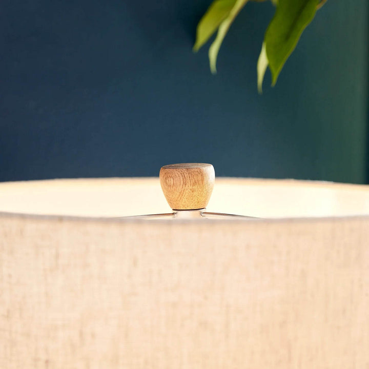 Side view of cream linen drum shade with subtle weave texture on minimalist wabi sabi lamp