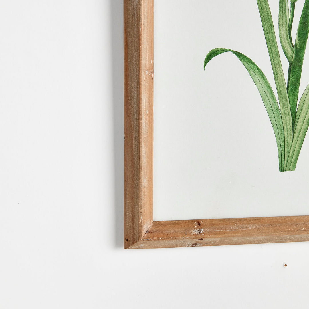 Corner detail of rustic wood frame with watercolor floral print styled for coastal farmhouse walls