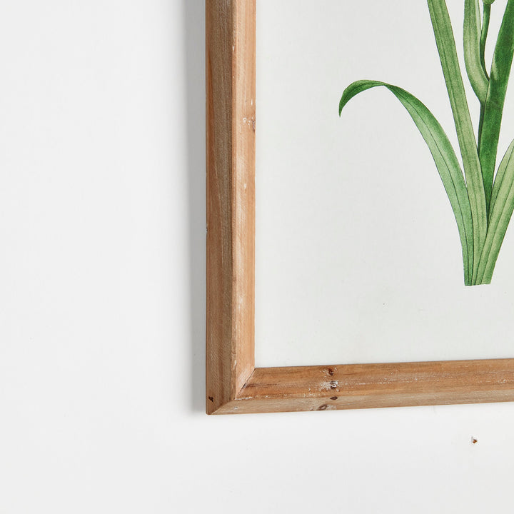 Corner detail of rustic wood frame with watercolor floral print styled for coastal farmhouse walls