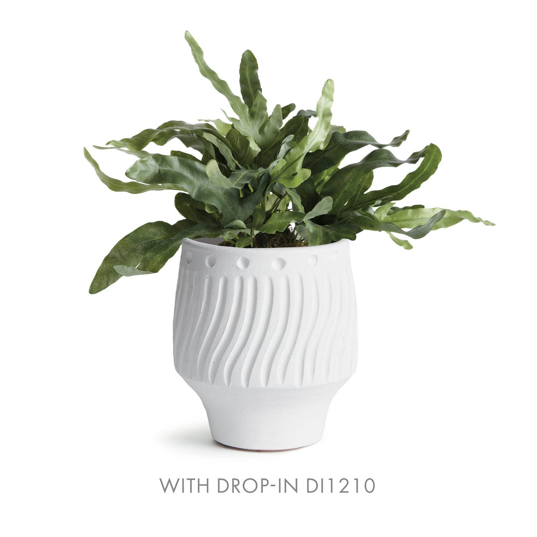 Matte white cachepot holding faux fern botanical drop-in with soft green leaves for relaxed indoor styling – Modern Organic.

